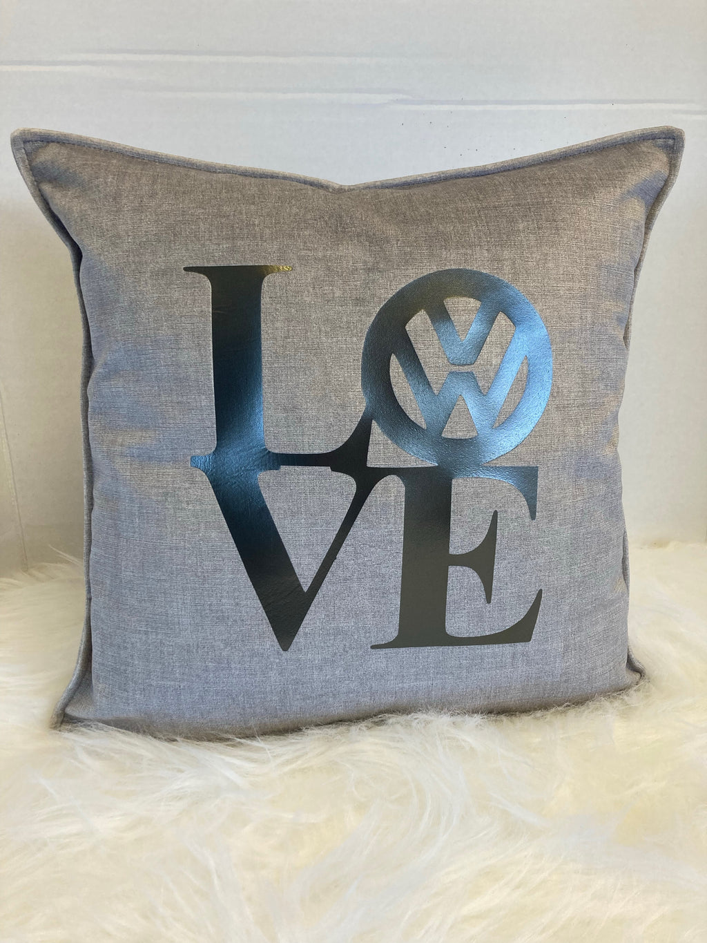 Gray pillow with 'LOVE' logo on a Heather 