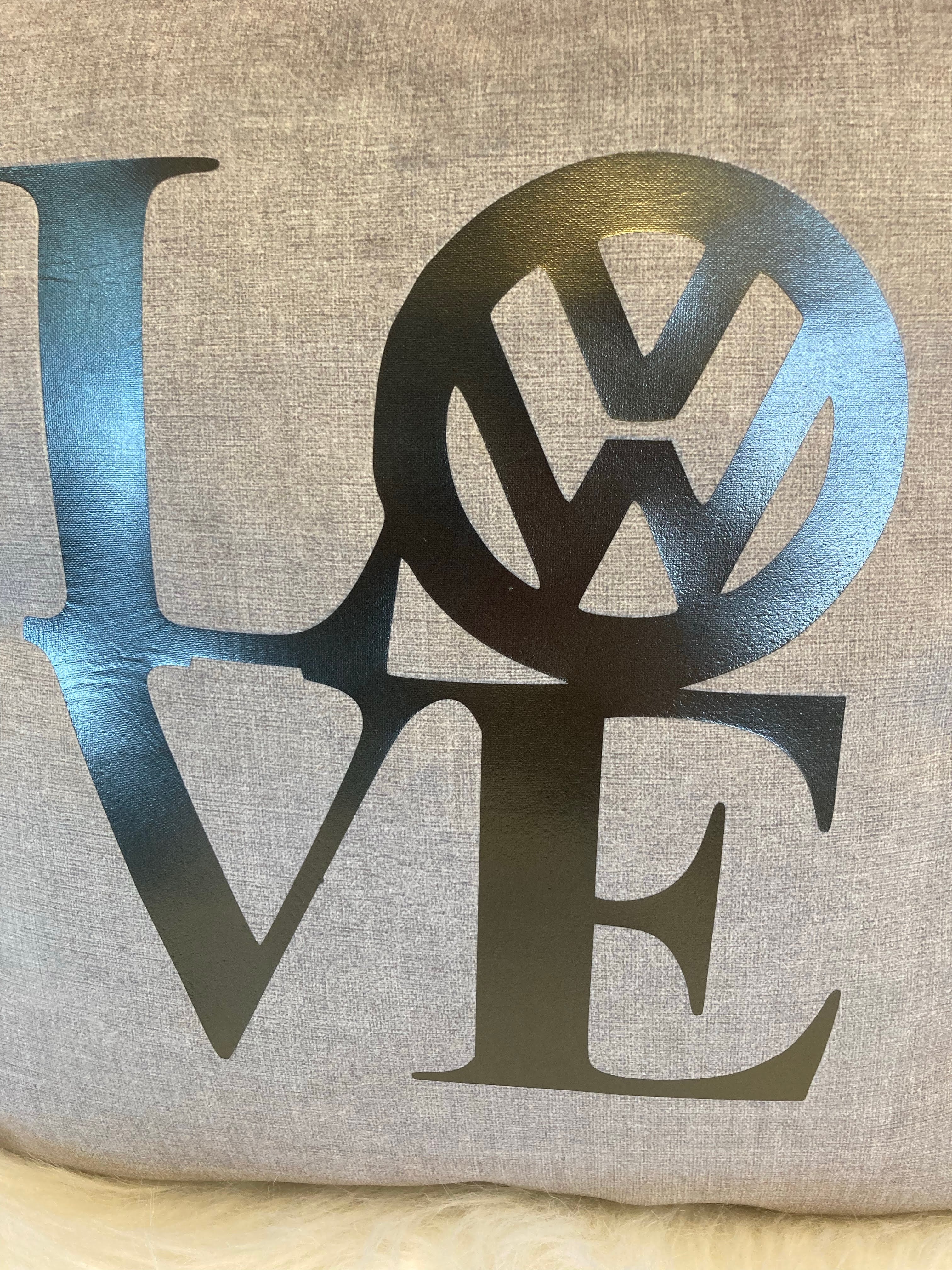 Decorative pillow with 'LOVE' Pop art logo on a Grey beige background